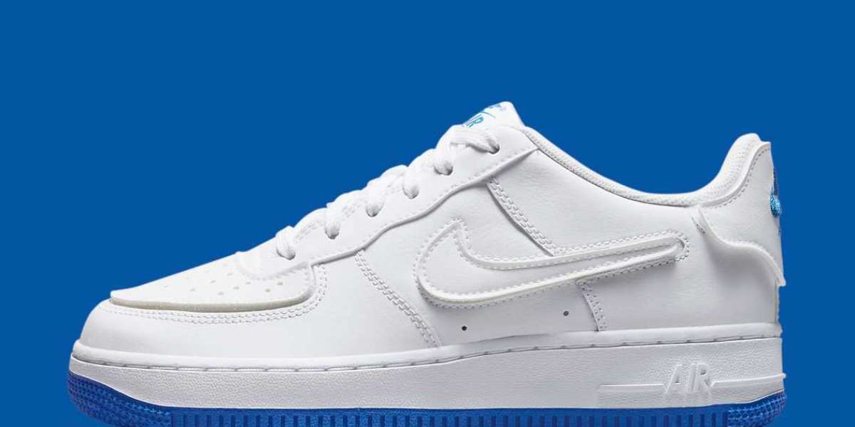 DB4545-105 A child's Nike Air Force 1 has a "Sapphire Blue" bottom and interchangeable soles